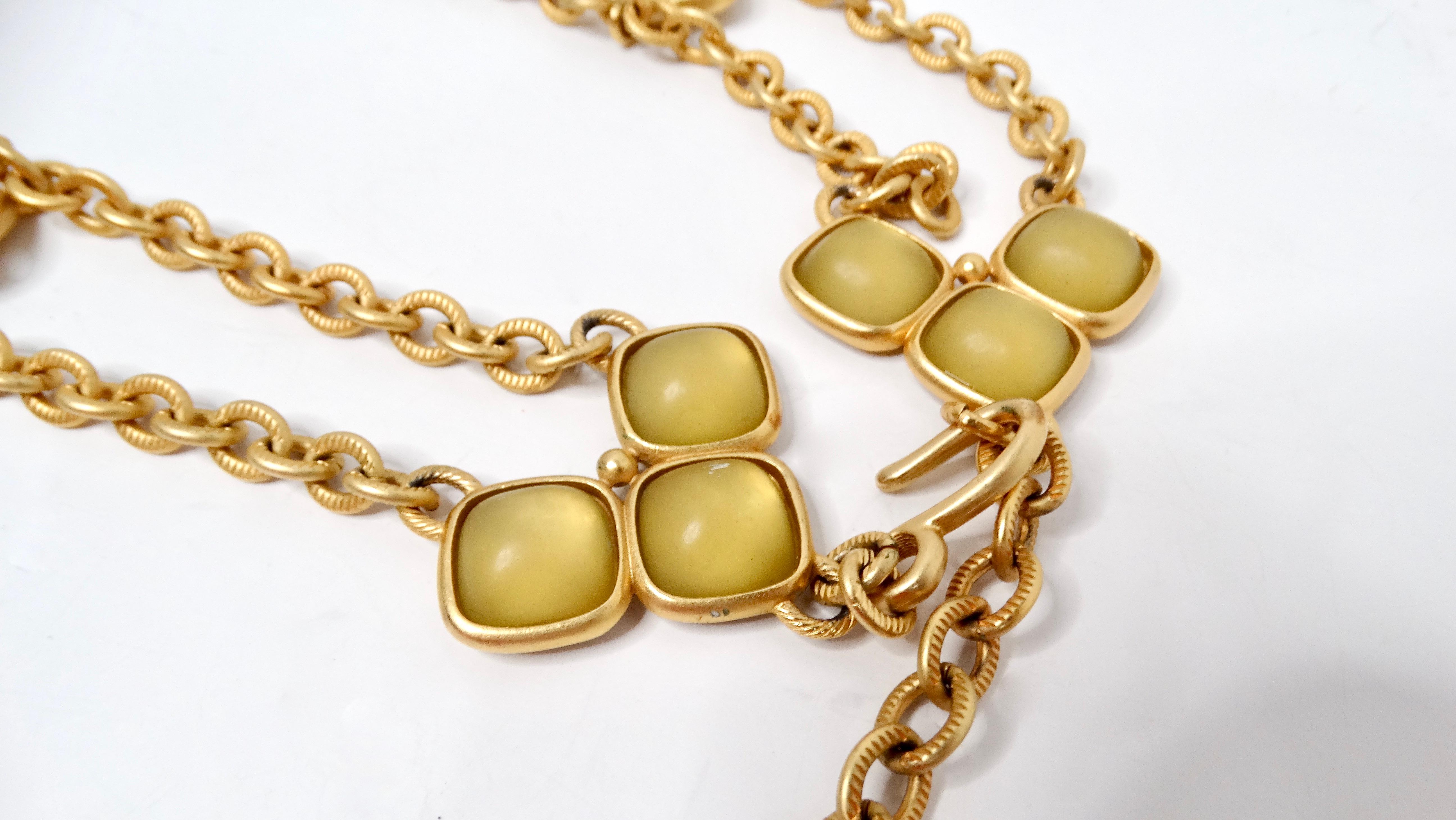 The Vintage Gold Tone Chain Link Belt with Olive Green Accents is a stunning accessory that effortlessly enhances any outfit. Its elegant gold links combined with rich olive green accents add a touch of sophistication and vintage charm. This belt