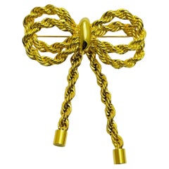 Vintage gold tone chain rope bow designer brooch