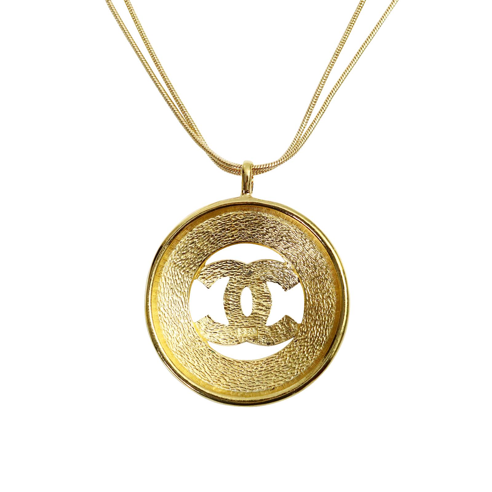 Vintage Gold Tone Chanel Dangling Disc with Double CC Circa 1980s In Good Condition In New York, NY