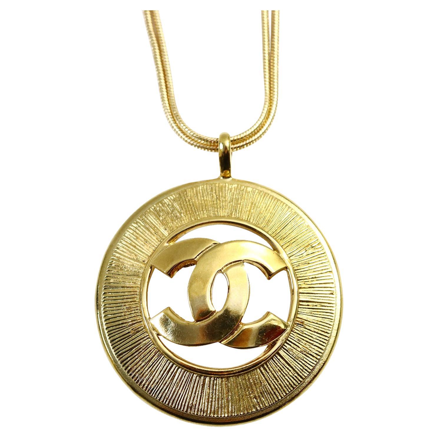 Vintage Gold Tone Chanel Dangling Disc with Double CC Circa 1980s