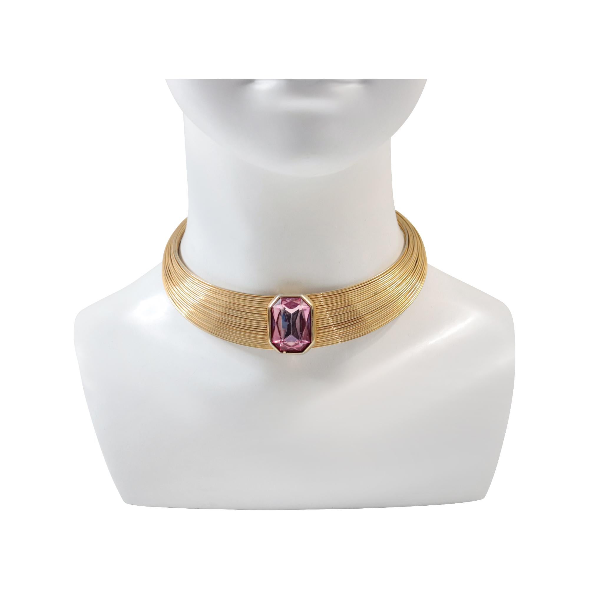 Vintage Gold Tone Choker Necklace with Pink Diamante, Circa 1980s. This piece features lots of gold-tone wires, presented together as a choker necklace.  They have small stops at the end of each section in the back where they stop.  This necklace