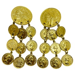 Orecchini a clip di design con monete d'epoca in tono dorato