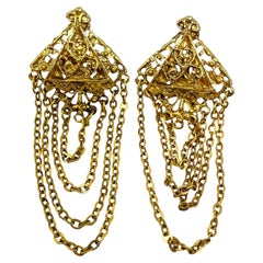 Orecchini a clip di design con catene penzolanti in tonalità oro vintage