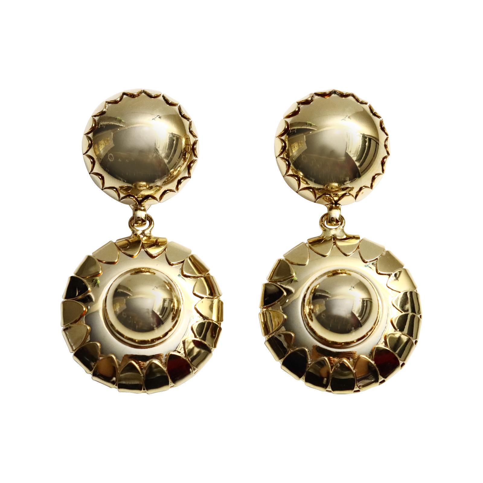 Vintage Gold Tone Dangling Circle Like Earrings Circa 2000s. These earrings remind me of the brand new Celine bracelet cuff that was just released with the circle like thing on it. Very Chic for summer or winter and stand out. Clip on.