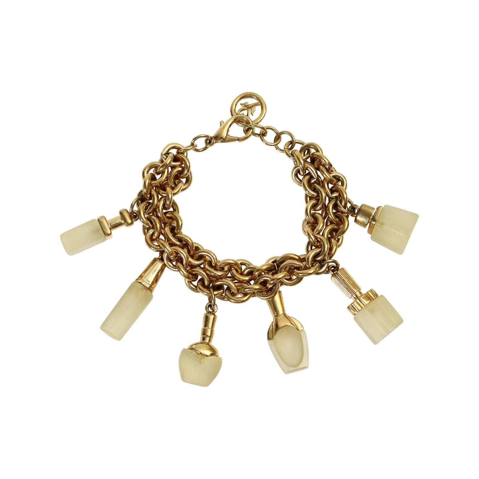 Vintage Gold Tone Dangling Perfume Bottle Bracelet Circa 1980s.  The bottom of each design of perfume bottle is all resin with gold tops.  There are 2 rows of chain and 6 different designs.  It is possible that this was for Boucheron or Lancome.  I