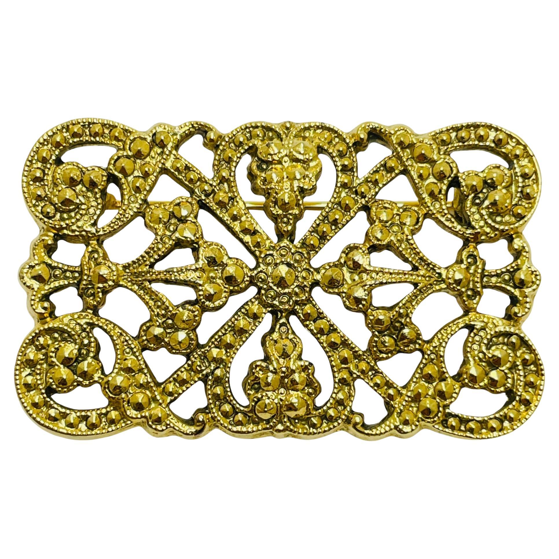Vintage gold tone designer brooch For Sale