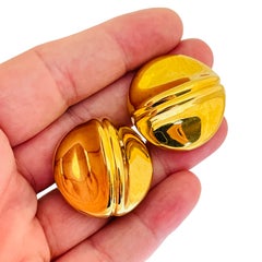 Vintage gold tone designer clip on earrings