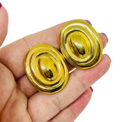 Vintage gold tone designer clip on earrings