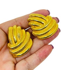 Vintage gold tone designer clip on earrings