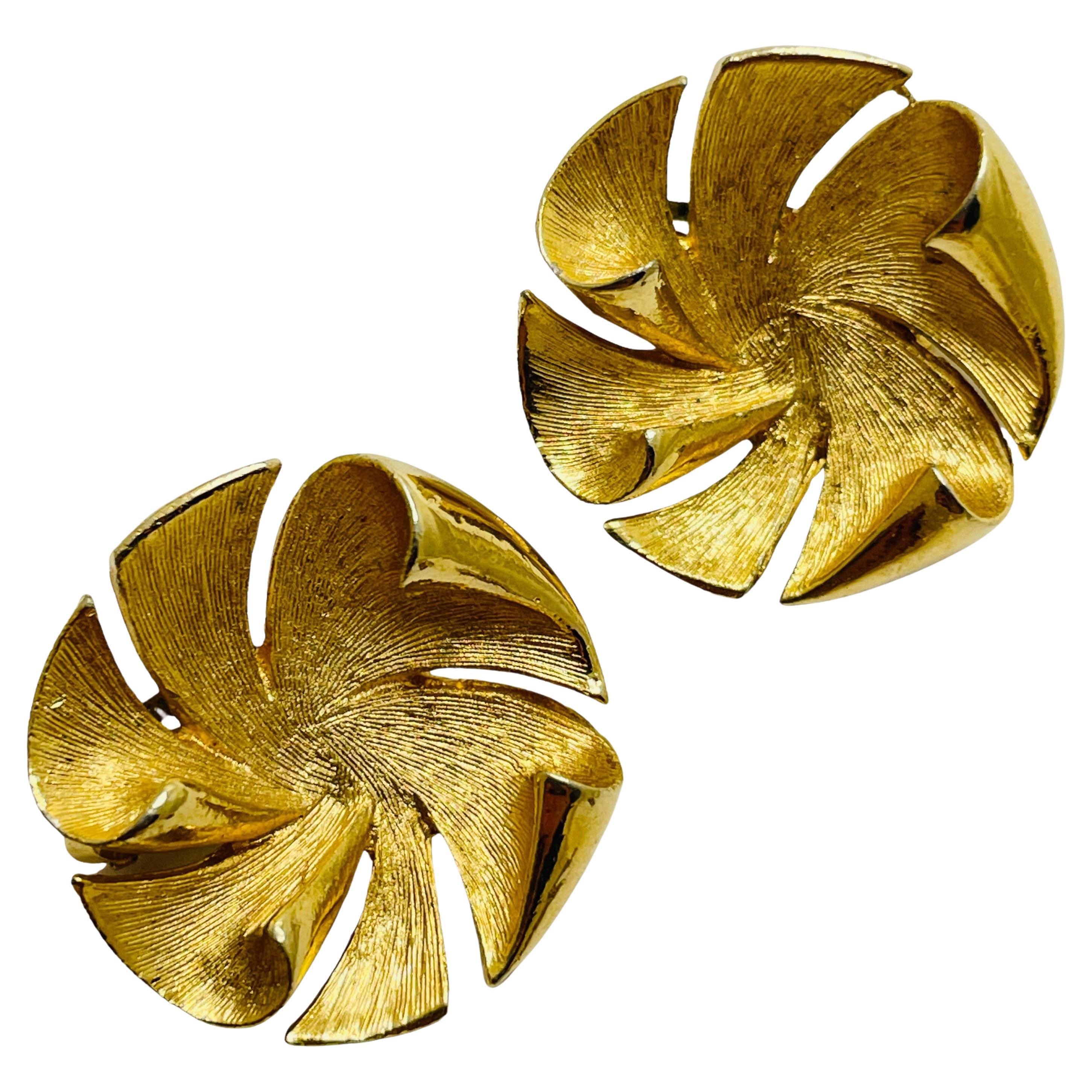 Vintage gold tone designer clip on earrings