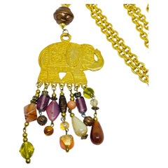 Collier long en perles de verre éléphant vintage doré
