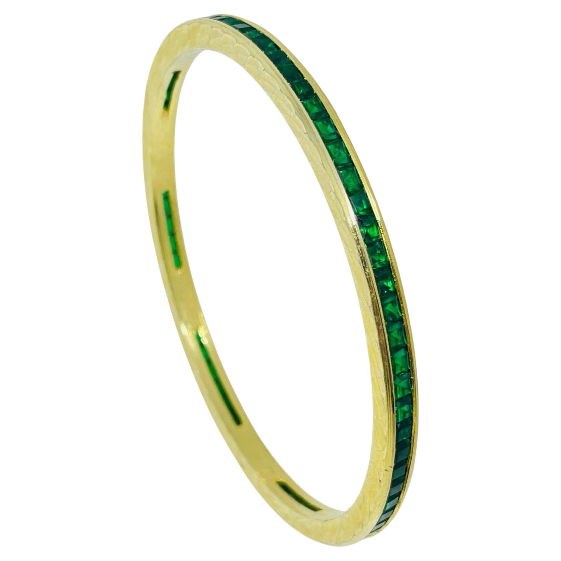 Vintage gold tone emerald green rhinestones designer bangle bracelet