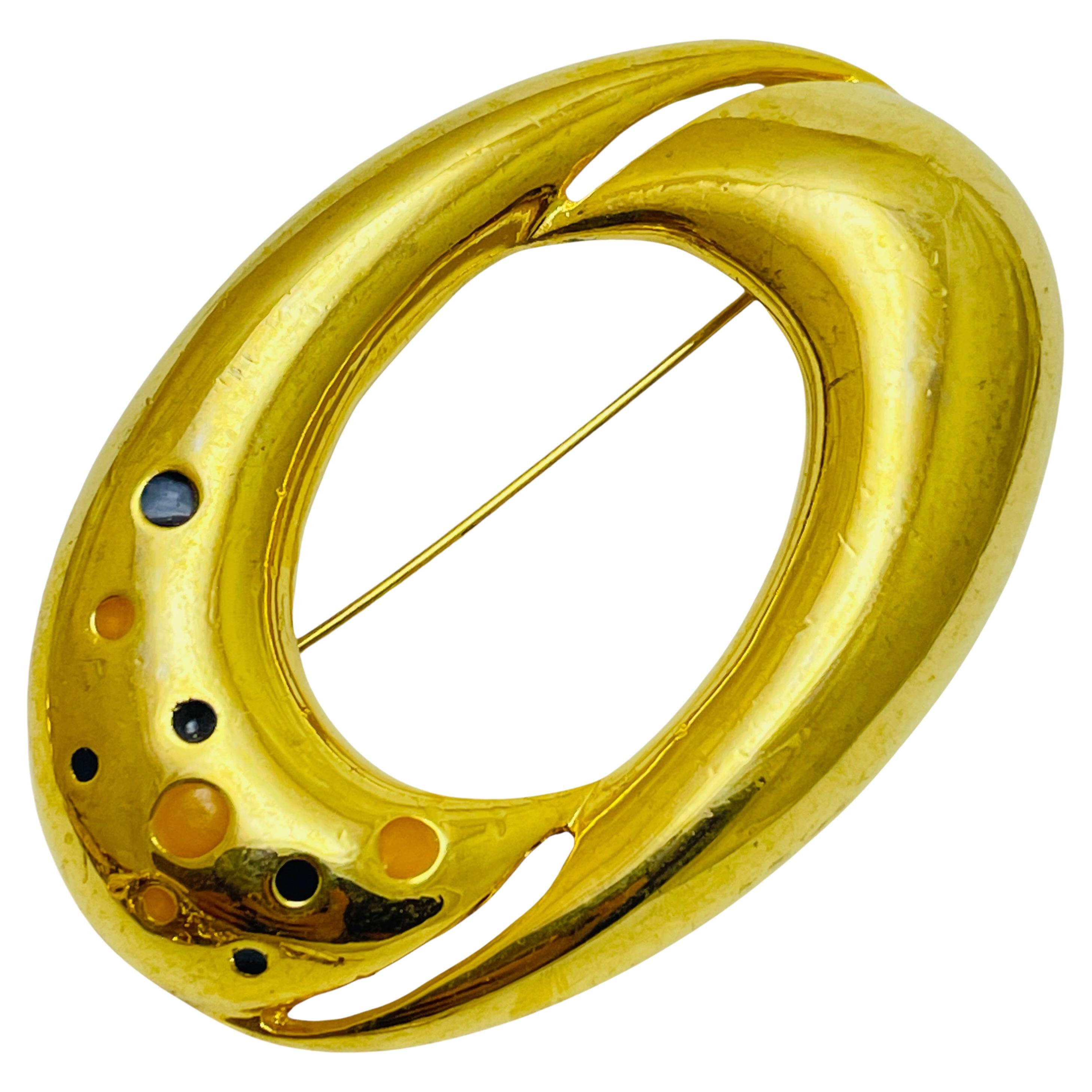 Vintage gold tone enamel designer brooch For Sale