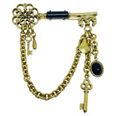 Vintage gold tone enamel key dangle charms designer brooch