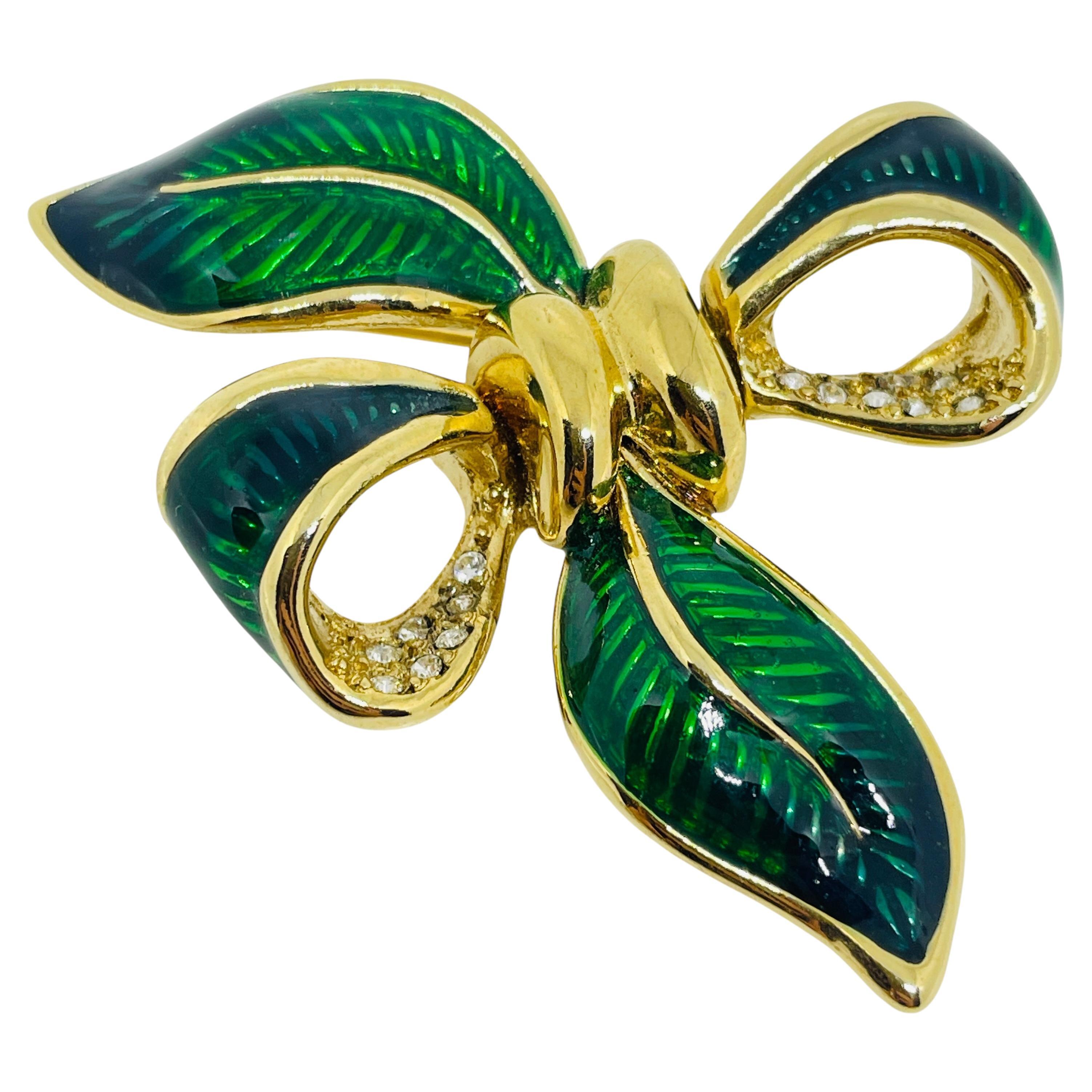Vintage gold tone enamel rhinestone bow designer brooch For Sale