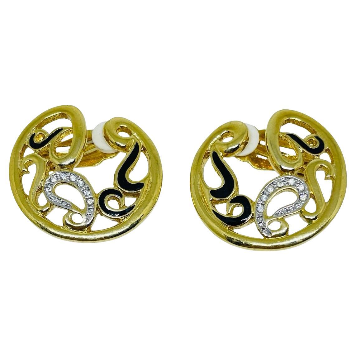 Vintage gold tone enamel rhinestone designer clip on earrings For Sale