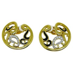 Vintage gold tone enamel rhinestone designer clip on earrings