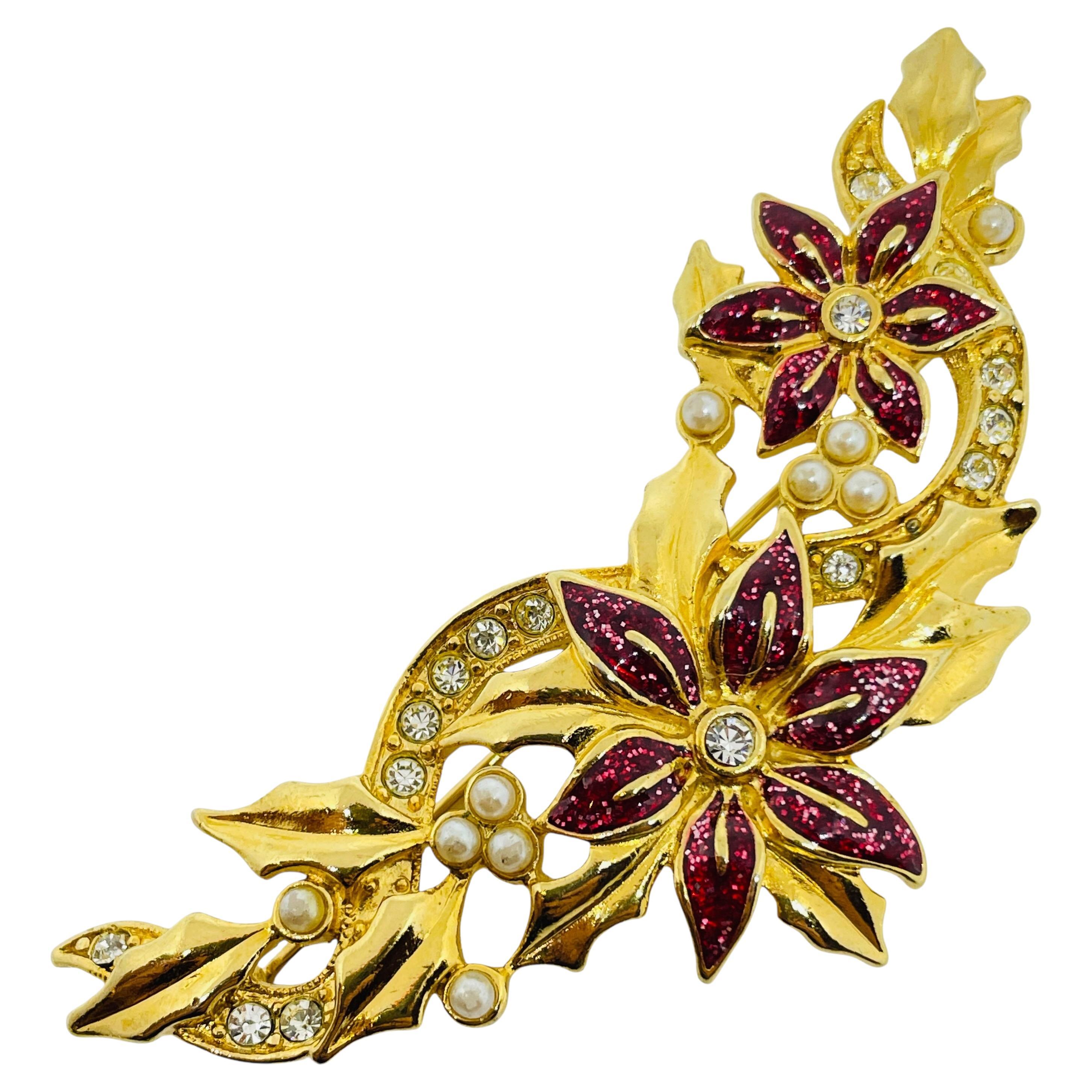 Spilla a fiore con strass in smalto dorato vintage