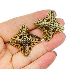 Vintage gold tone Etruscan style designer 80's clip on earrings