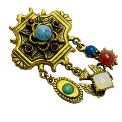Vintage gold tone faux gemstones dangle designer brooch