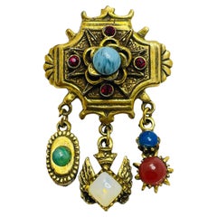 Vintage gold tone faux gemstones dangle designer brooch