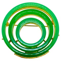 Broche modernista de diseño vintage, en tono dorado, con resina verde imitación de jade