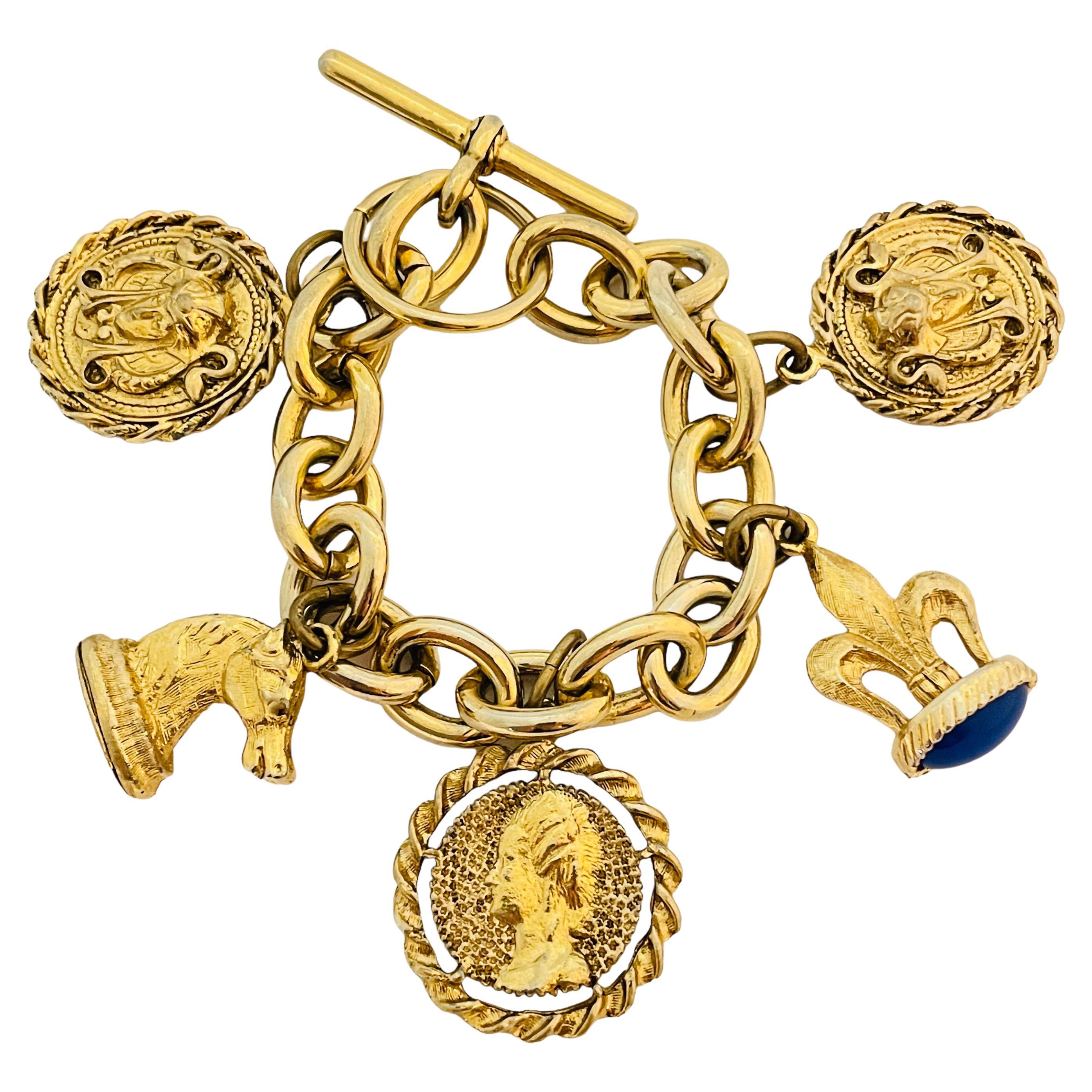 Vintage gold tone faux lapis charm chain bracelet with toggle clasp For Sale