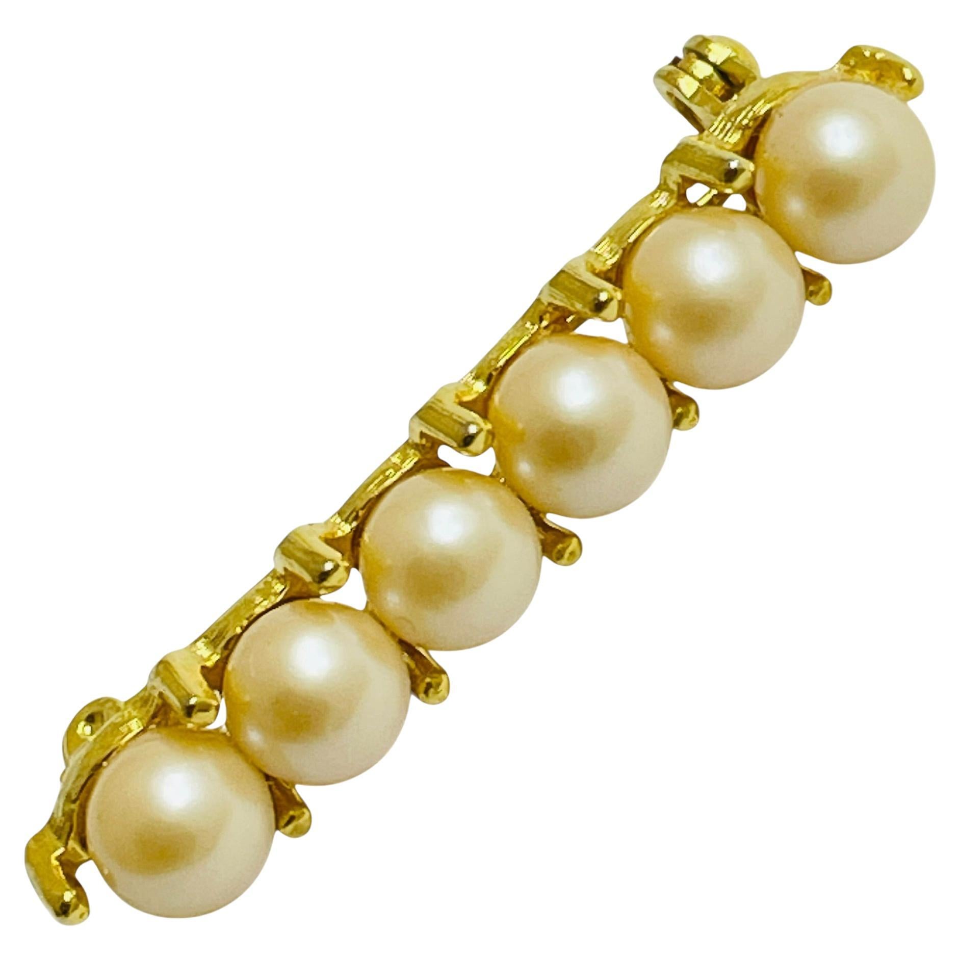 Vintage gold tone faux pearl brooch
