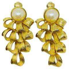 Vintage gold tone faux pearl designer clip earrings