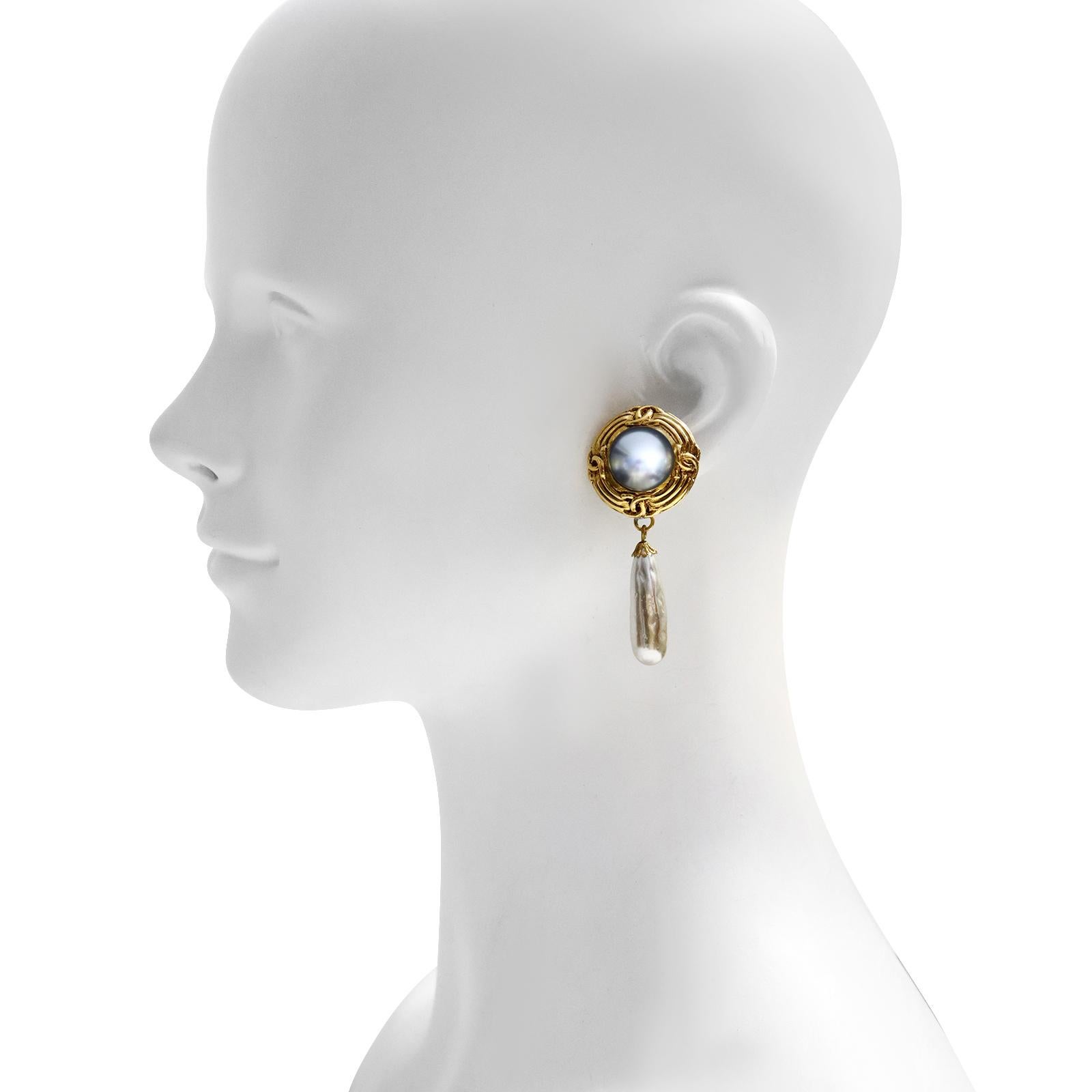 Vintage French Gold Tone  Faux Pearl Grey and Ivory Dangling Earrings. Very Much in the style of Chanel. Just have a good look at these.  The surround of the color gold is in the style of Chanel.  These French made earrings have the design in the