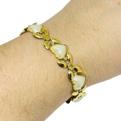 Bracelet design vintage en fausses perles et en coeur