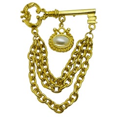 Vintage gold tone faux pearl key dangle chains designer brooch
