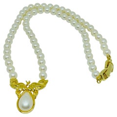 Vintage gold tone faux pearls beaded designer necklace