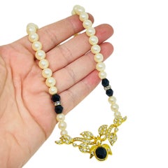 Vintage gold tone faux pearls crystals designer necklace