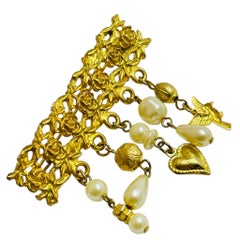 Vintage gold tone faux pearls dangle charms designer brooch