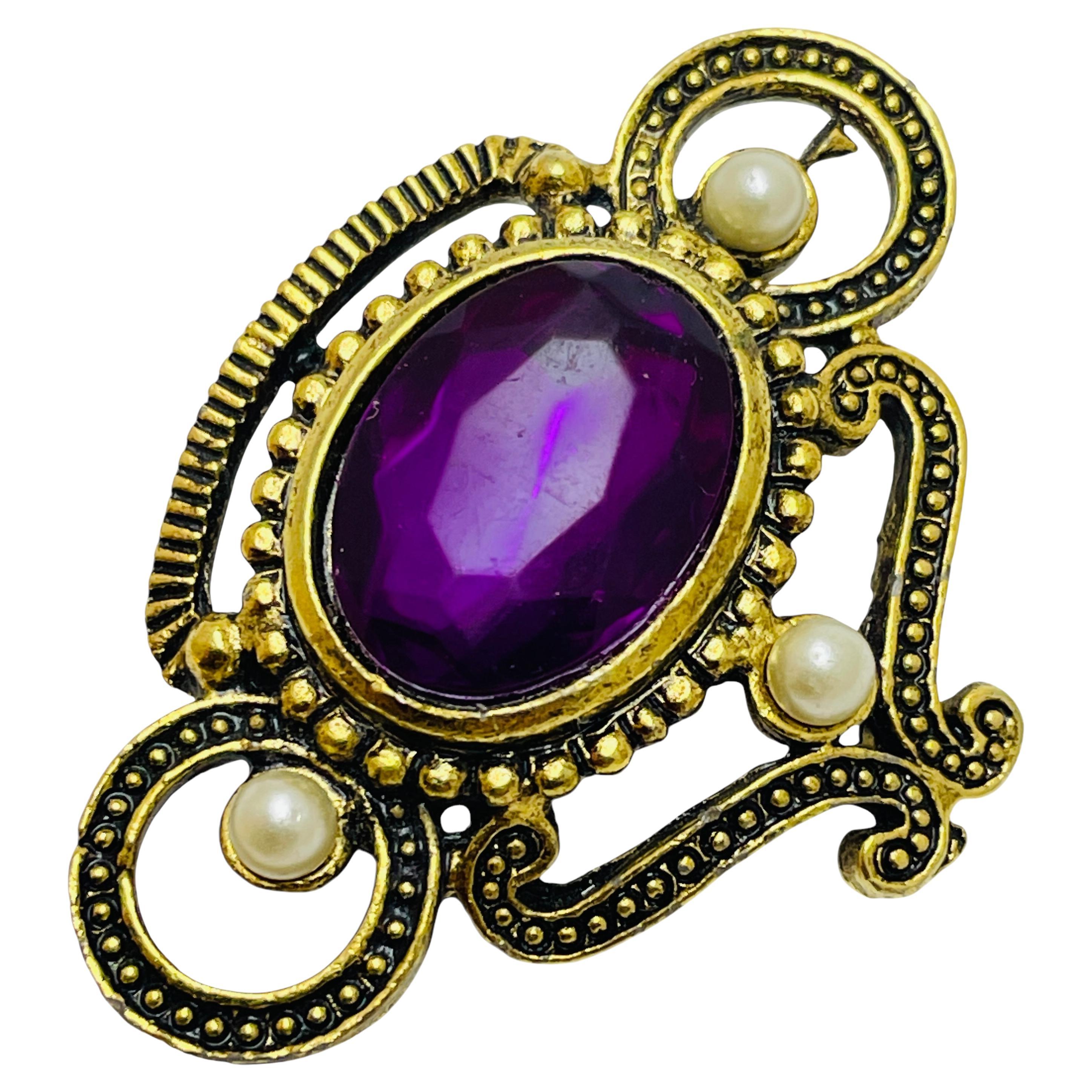 Broche de créateur vintage en fausses pierres dorées
