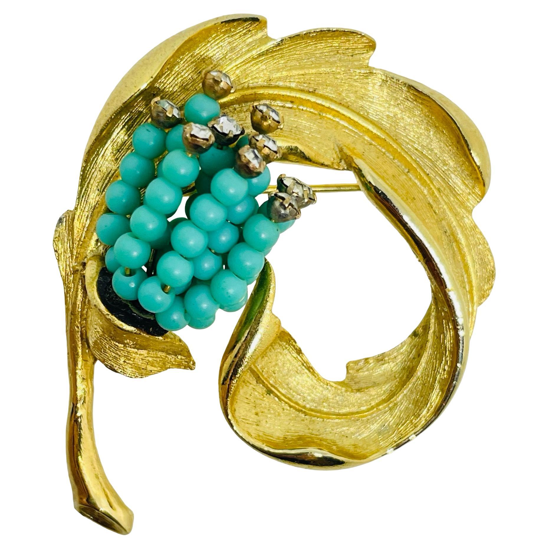 Vintage gold tone faux turquoise rhinestone designer brooch brooch