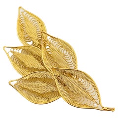 Vintage gold tone filigree leaf brooch designer