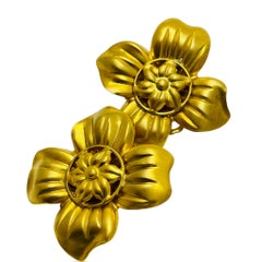 Vintage gold tone flower designer clip on earrings