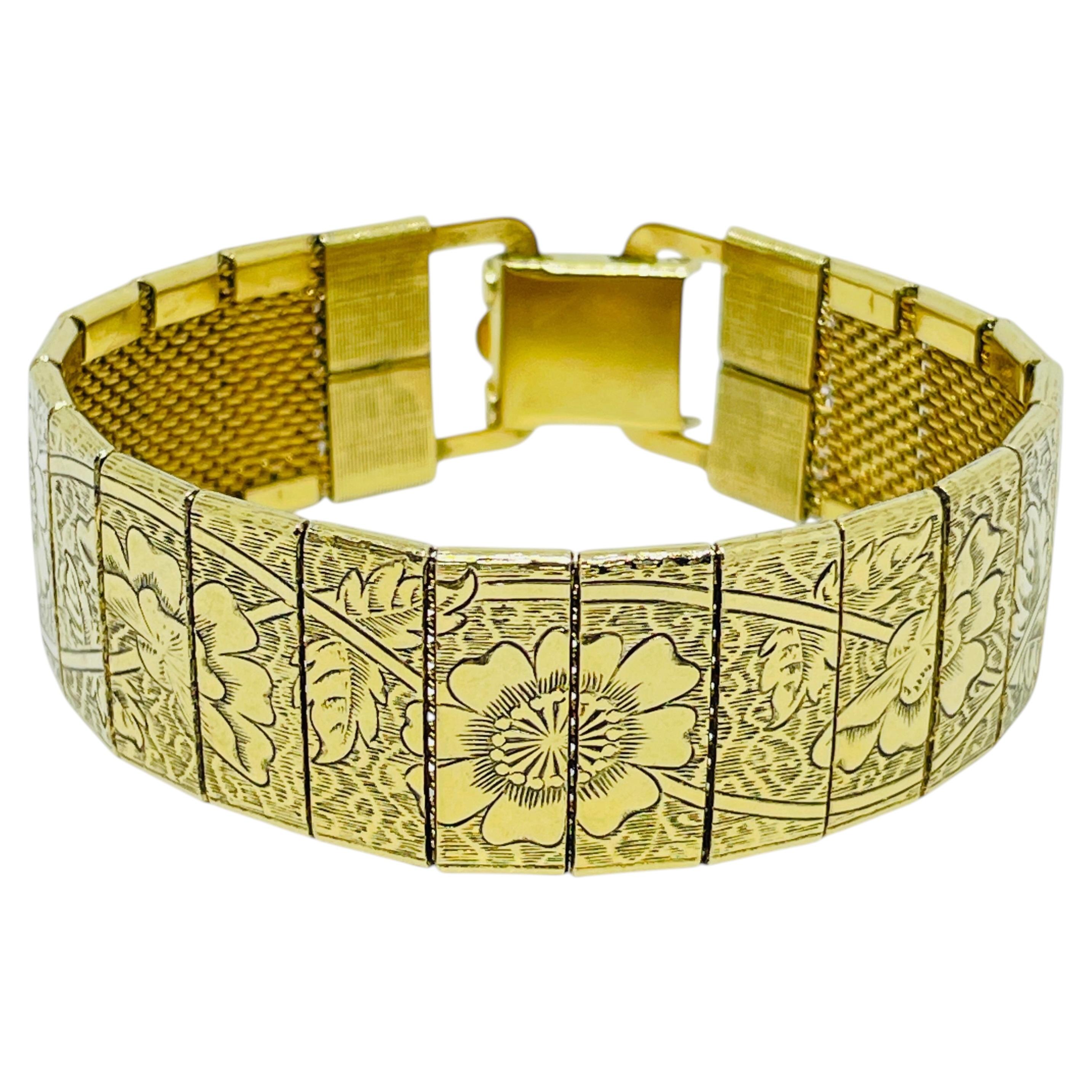 Vintage gold tone flowers etched designer link bracelet