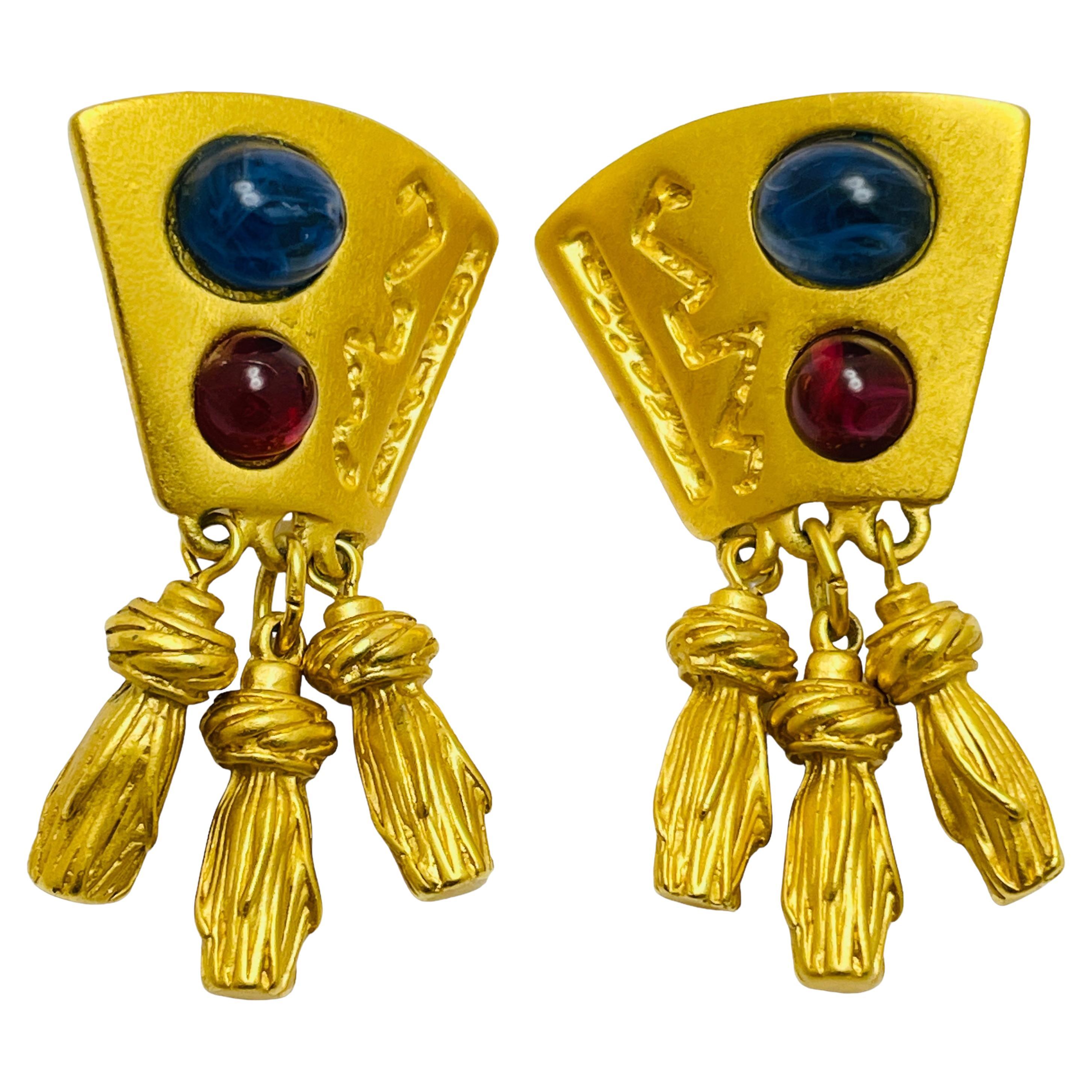 Boucles d'oreilles à clip vintage en verre doré avec pampilles.