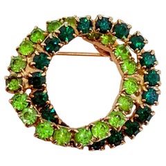 Vintage gold tone green rhinestone double circle brooch