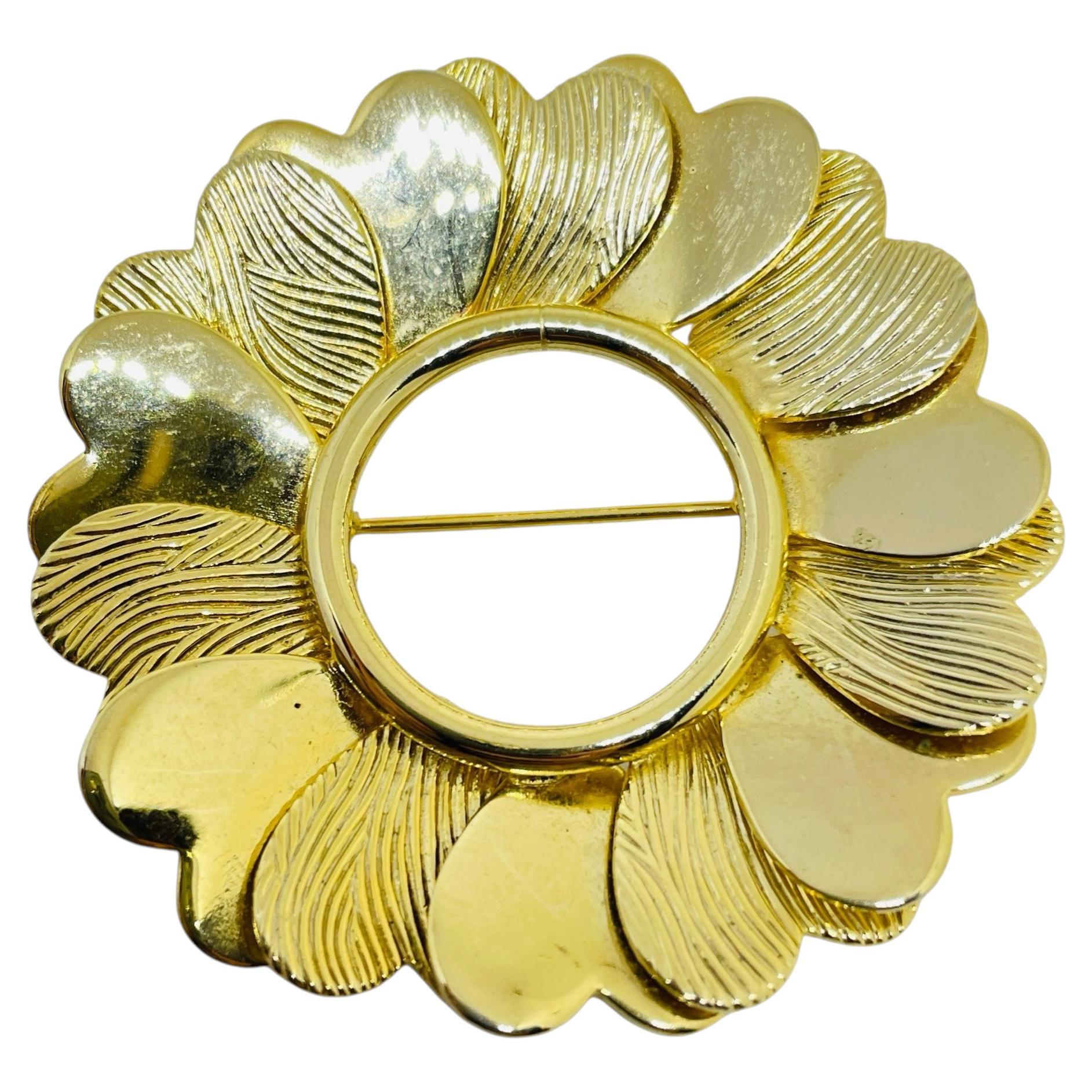Vintage gold tone hearts circle designer brooch
