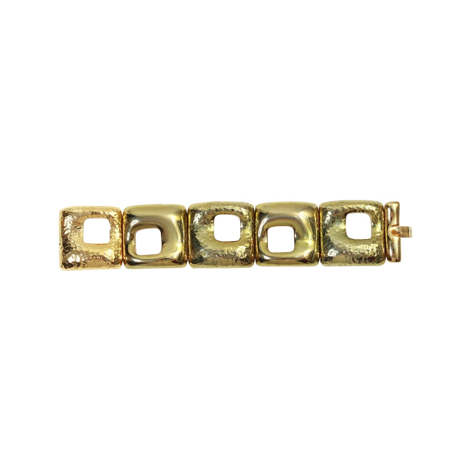 Vintage Gold Tone Heavy Link Bracelet Circa 1980s. This bracelet has large and very substantial squares.  Two are shiny gold and three are hammered gold tone.  They close tightly with a slide in clasp but what makes it unusual is that they are stung