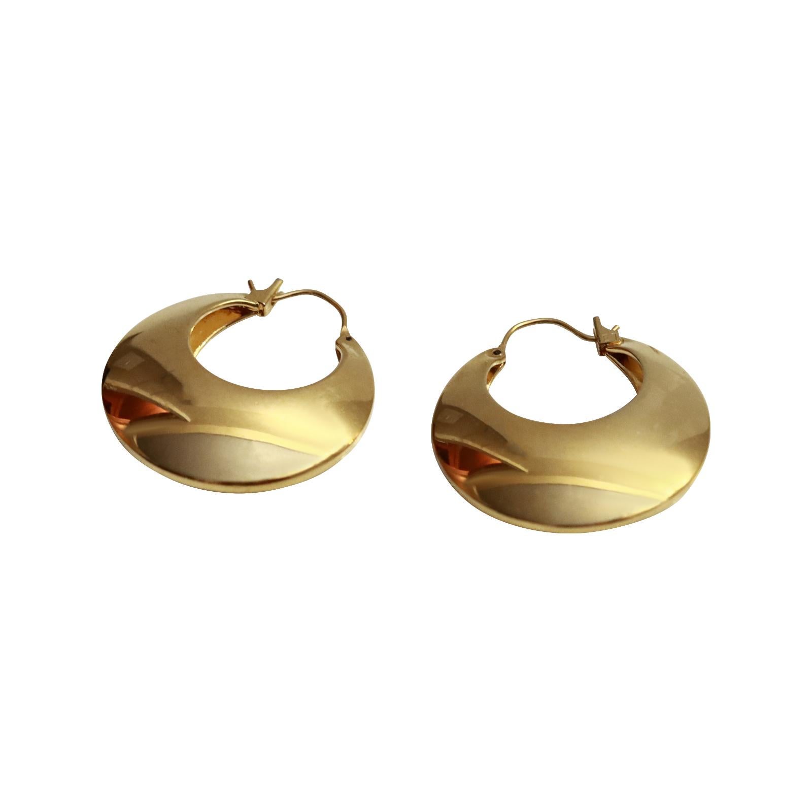 Vintage Gold Tone Hoop Earrings Circa 1980s. These are the earrings that you didn't know you needed until you try them on.  They are not giant in size but giant in punch.  Very chic. They are so special.  Well made.  They are hollow on the inside