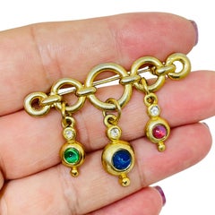 Vintage gold tone jewel ruby sapphire emerald glass dangle designer brooch
