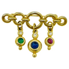 Vintage gold tone jewel ruby sapphire emerald glass dangle designer brooch