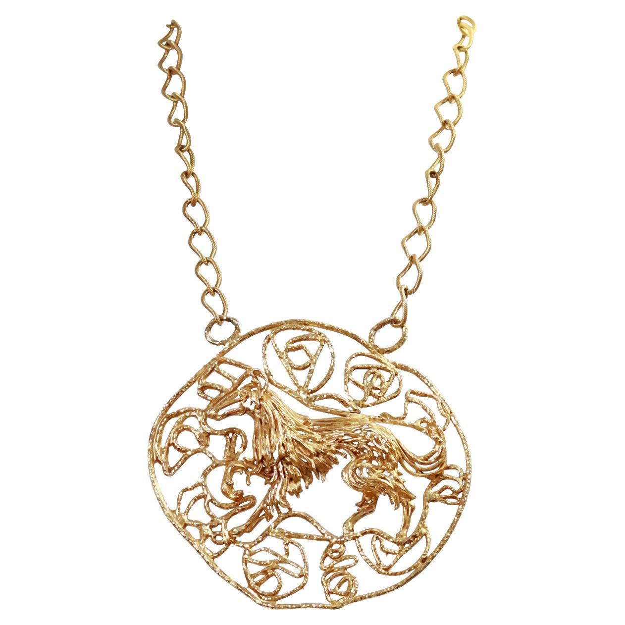 Vintage Gold  Tone Large Round Necklace Circa 1980's.  This is so special and so unusual.  I believe it is a horse in the middle of the circle.  This looks so chic and amazing in the middle of  a white blouse or black turtle neck or even a white