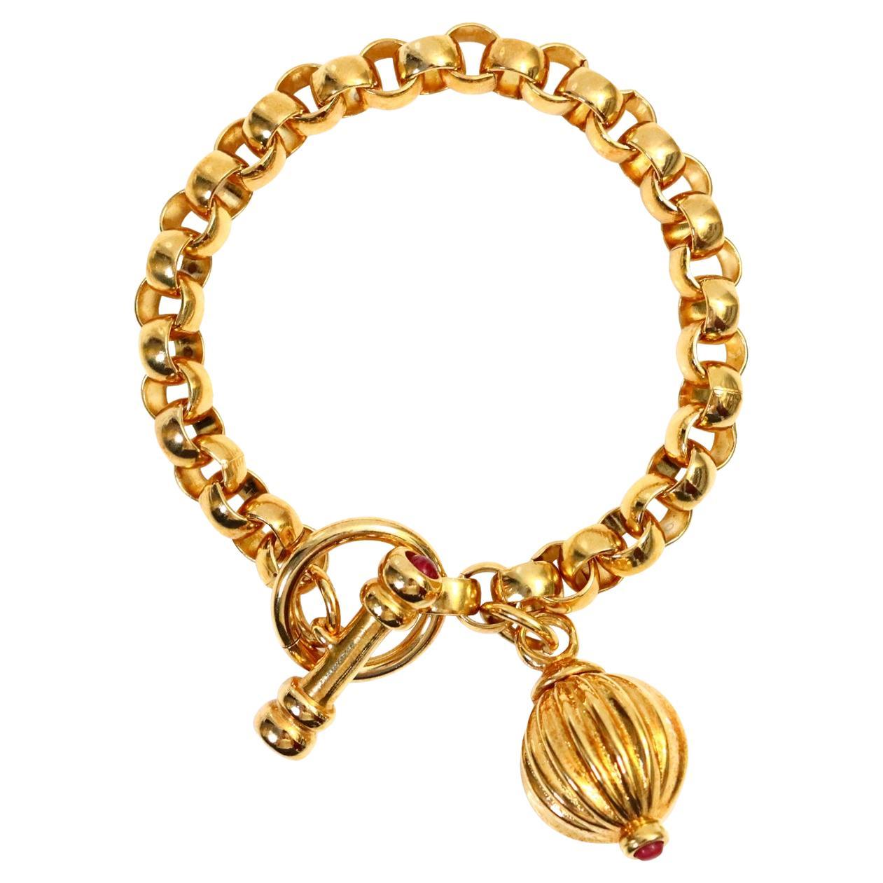 Vintage Gold Tone Link Bracelet with Dangling Piece and Toggle Circa 1990s For Sale