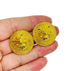 Orecchini a clip vintage di design con testa di leone in tonalità oro